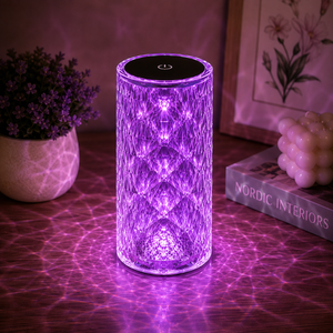 Crystal Rose LED table lamp glowing purple in a modern interior