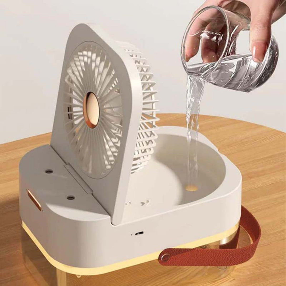 White humidifying desk fan showing water reservoir filling