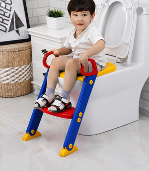 Toddler using colorful potty training seat with step ladder